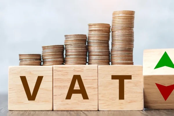 Business owner reviewing HMRC VAT assessment letter with financial documents